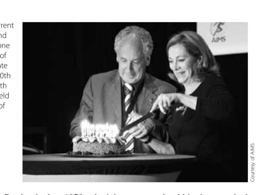 Paco Borao, current AIMS president, and Kathrine Switzer, one of the originators of the group, celebrate the association's 30th birthday at the 19th World Congress held in Prague in May of 2012.