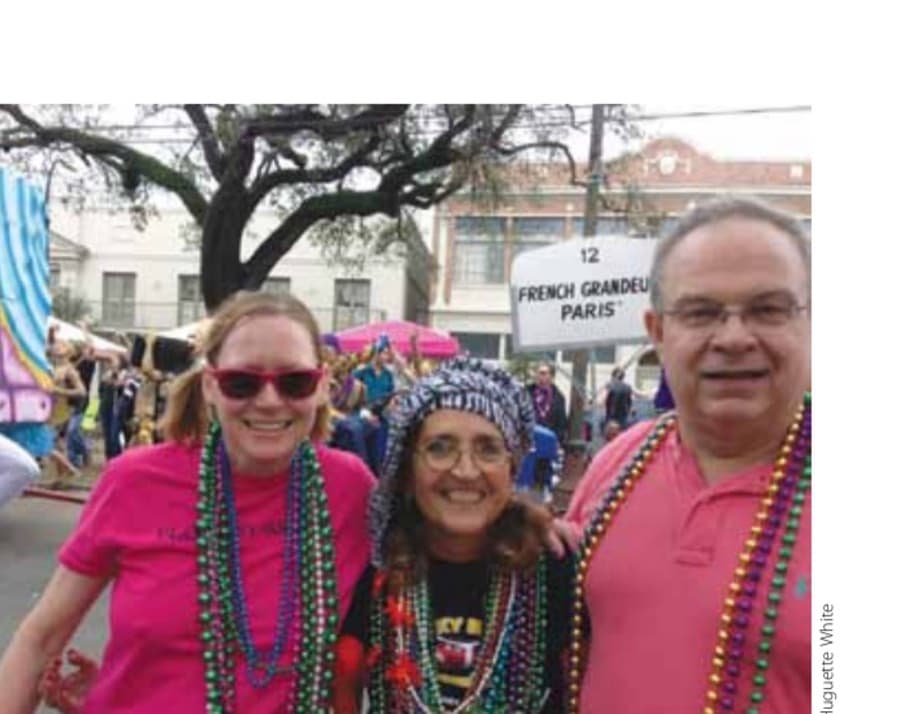 The R.O. is timed to coincide with the Mardi Gras season. Dan Brenden and Huguette White (center) watched three parades after the race.