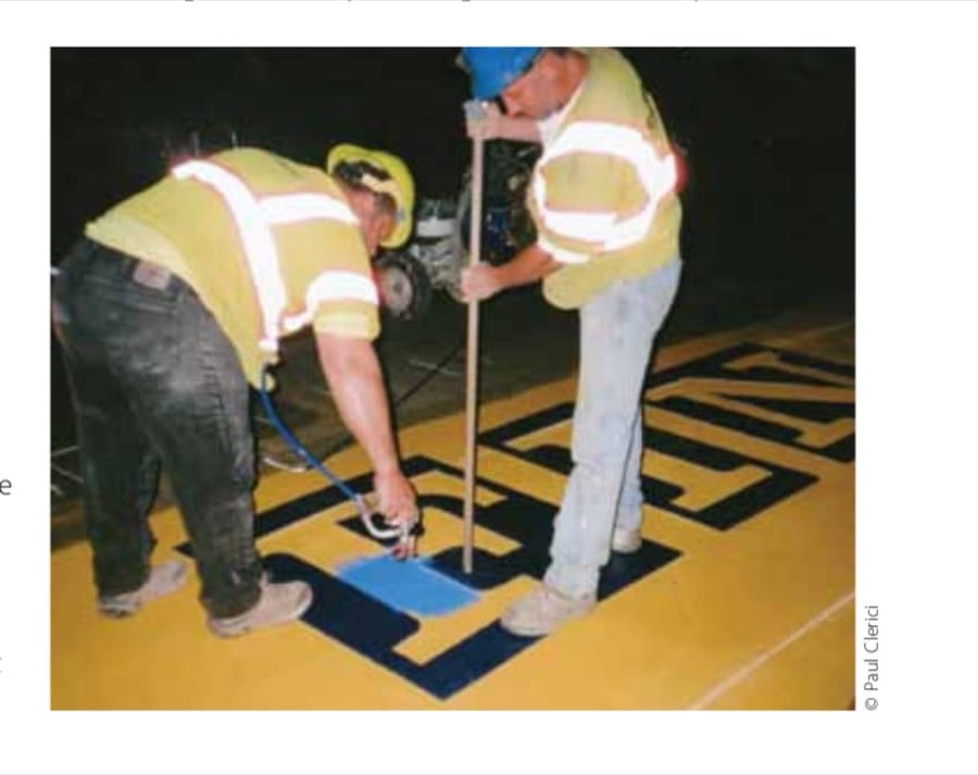 Building Boston 6 Highway safety traffic designers Eric House, left, and Will Belezos begin the early-morning process on the Wednesday after the Boston Marathon to create the finish line on Boylston Street that is seen throughout the rest of the year.