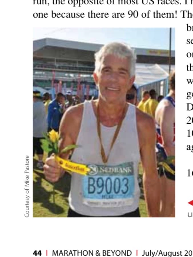 The author after his ninth Comrades finish, in under 9 hours. A rose for everyone is a nice touch.