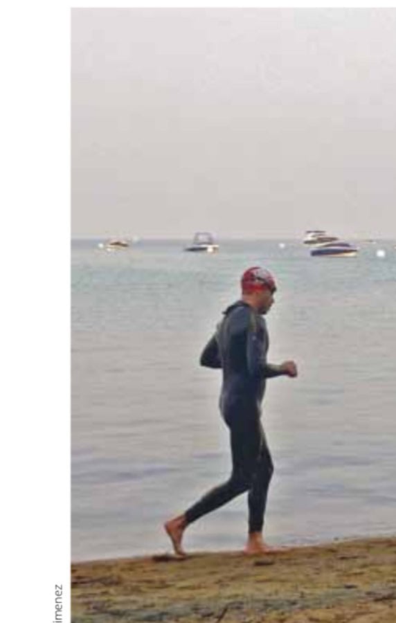 Theironman Marathon 12 Quick jog in the sand before entering Lake Tahoe for the second lap of the swim.