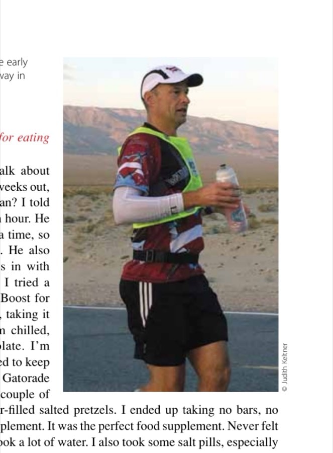 Brian is a lone runner in the early morning down a desert highway in Death Valley.
