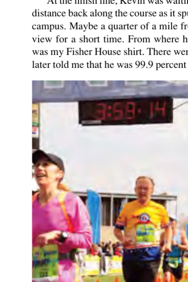The author crossing the finish line inside the Glass Bowl on the University of Toledo campus.