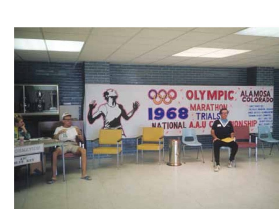 The 1968 Olympic Marathon Trials 12 My running buddy, Bill Lamb (right), in the Plachy Field House foyer waiting for me to shower up before the awards banquet. The runner on the left is Tom Heinonen, who went on to become head women's cross-country and track coach at the University of Oregon.