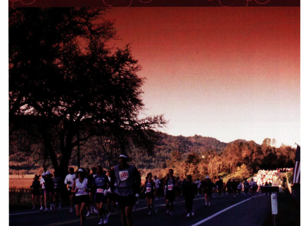 Running in Literature: Coming Into the Modern Age, the Literature Sprints Ahead. Part 4 of 5 15 Runners on the road at the Napa Valley Marathon, with oak trees and hills in the background at dawn.