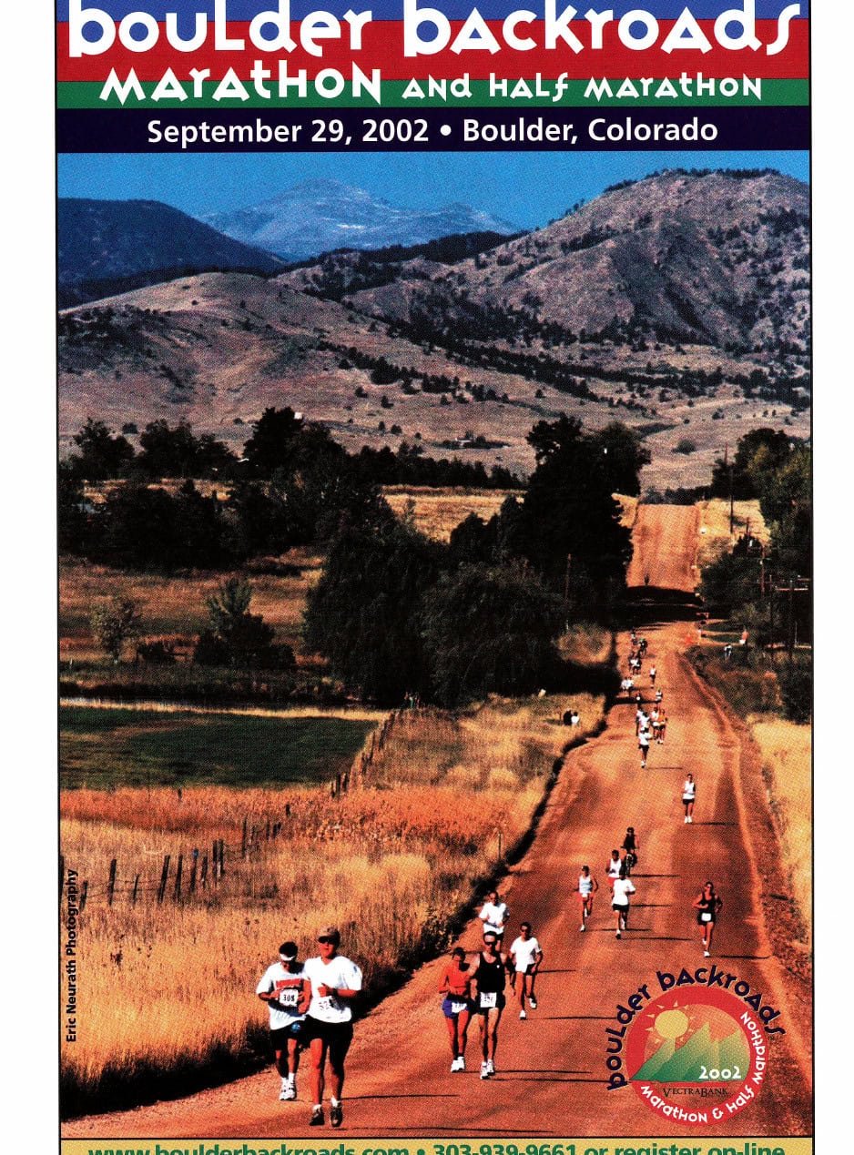 Runners on a dirt backroads course near Boulder, Colorado, with the Rocky Mountains in the background. Boulder Backroads Marathon and Half Marathon, 2002.
