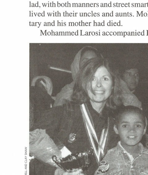Karen Mitchell, with the third-place woman's award, and her buddy Mohammed Larosi.