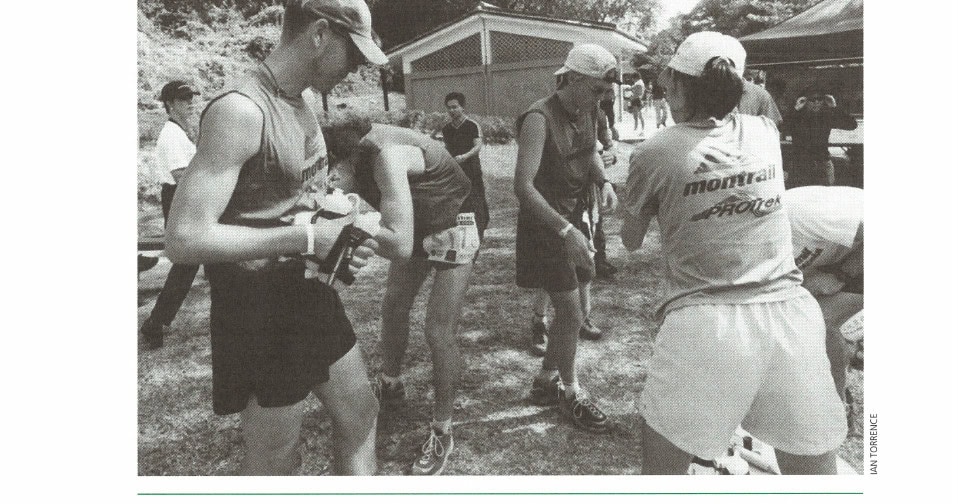 The team passes through one (of many) aid stations along the 100K course.