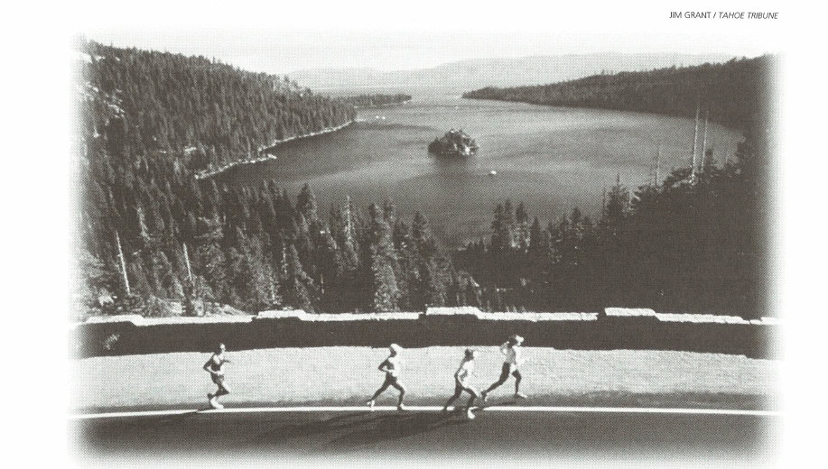 Runners along the Lake Tahoe shoreline with Emerald Bay in the background. Photo: Jim Grant / Tahoe Tribune
