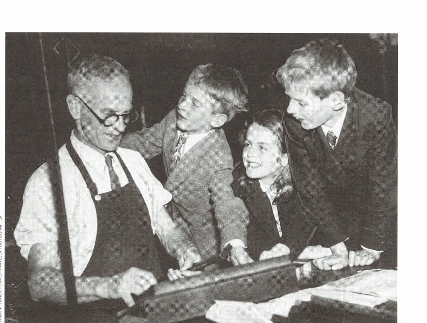 DeMar@Home: What Was It Like With "Mr. Marathon" Living in the Same Neighborhood? 24 Clarence couldn't be happier—he's on the job as a compositor at the Boston Herald-Traveler where his "bosses" couldn't be nicer. Left to right: Dad, Charles, Dorothy, and Robert.