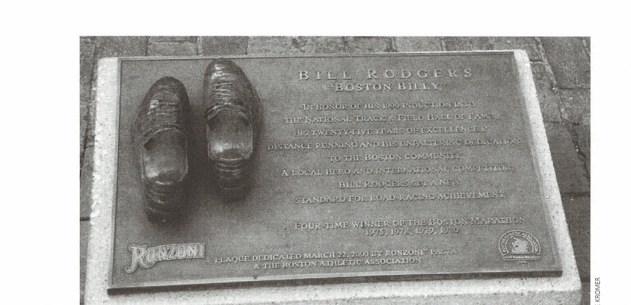 This plaque honoring Bill Rodgers is embedded in the walkway near his running shoe store in Boston.
