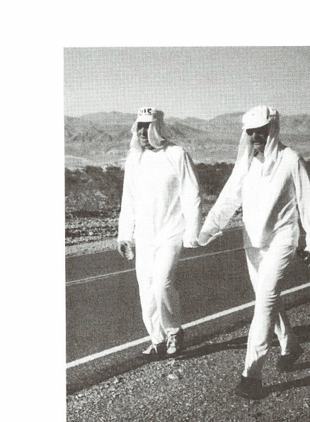 Into the Valley of Death 23 The flowing white suits shown here help keep the worst of the radiant heat off runners' bodies while they travel through the desert of Death Valley. (Photo: Jane Byng)