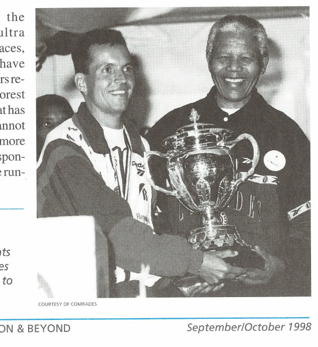 Where Eagles Dwell 8 Nelson Mandela, South Africa's president, presents the 1997 Comrades Marathon trophy to Charl.