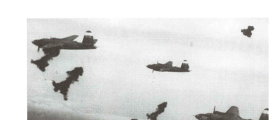As an aerial photographer, Steele took this photo of allied planes under attack while on a bombing mission over German-controlled installations in France.