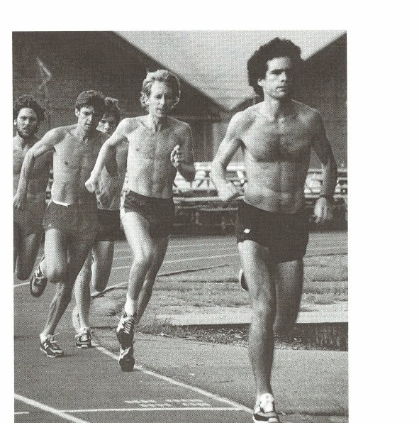 Runners training together on a track.
