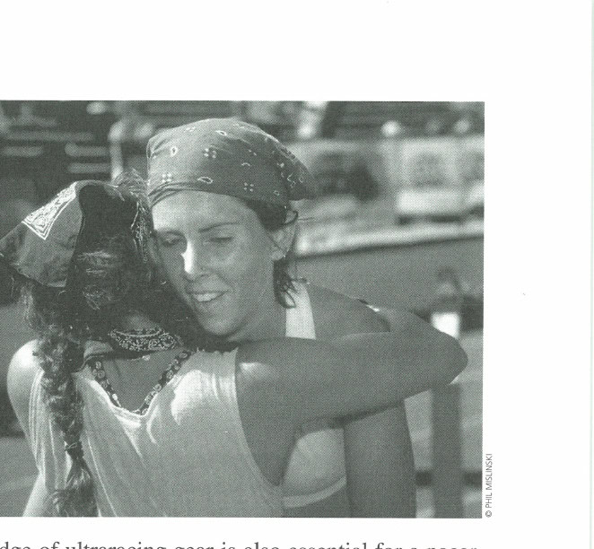 Pacer Catra Corbett (with braid) hugs her runner, Julia Bramer, at the finish of the 2001 Western States 100.