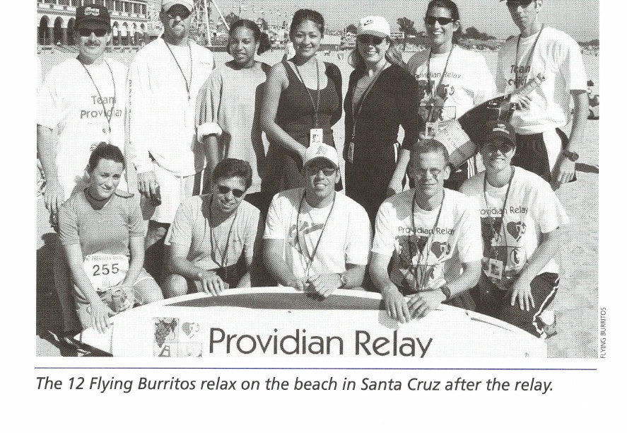 The 12 Flying Burritos relax on the beach in Santa Cruz after the relay.