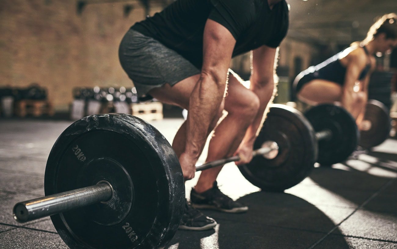 Weightlifting in a gym setting.