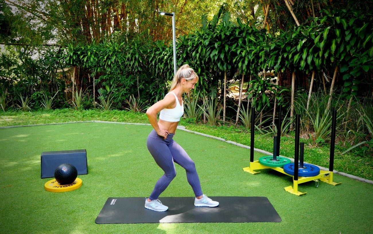 a woman standing on a mat