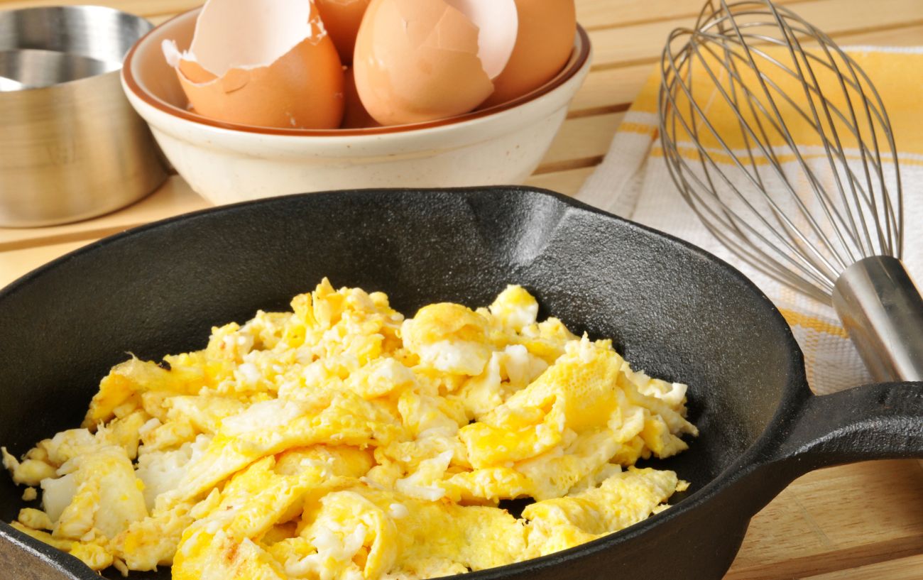 Scrambled eggs in a pan.