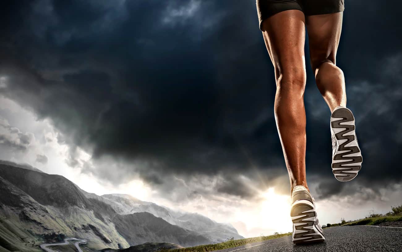 How To Improve Running Form: 29 Ways To Run More Efficiently 7 A person running at sunrise.