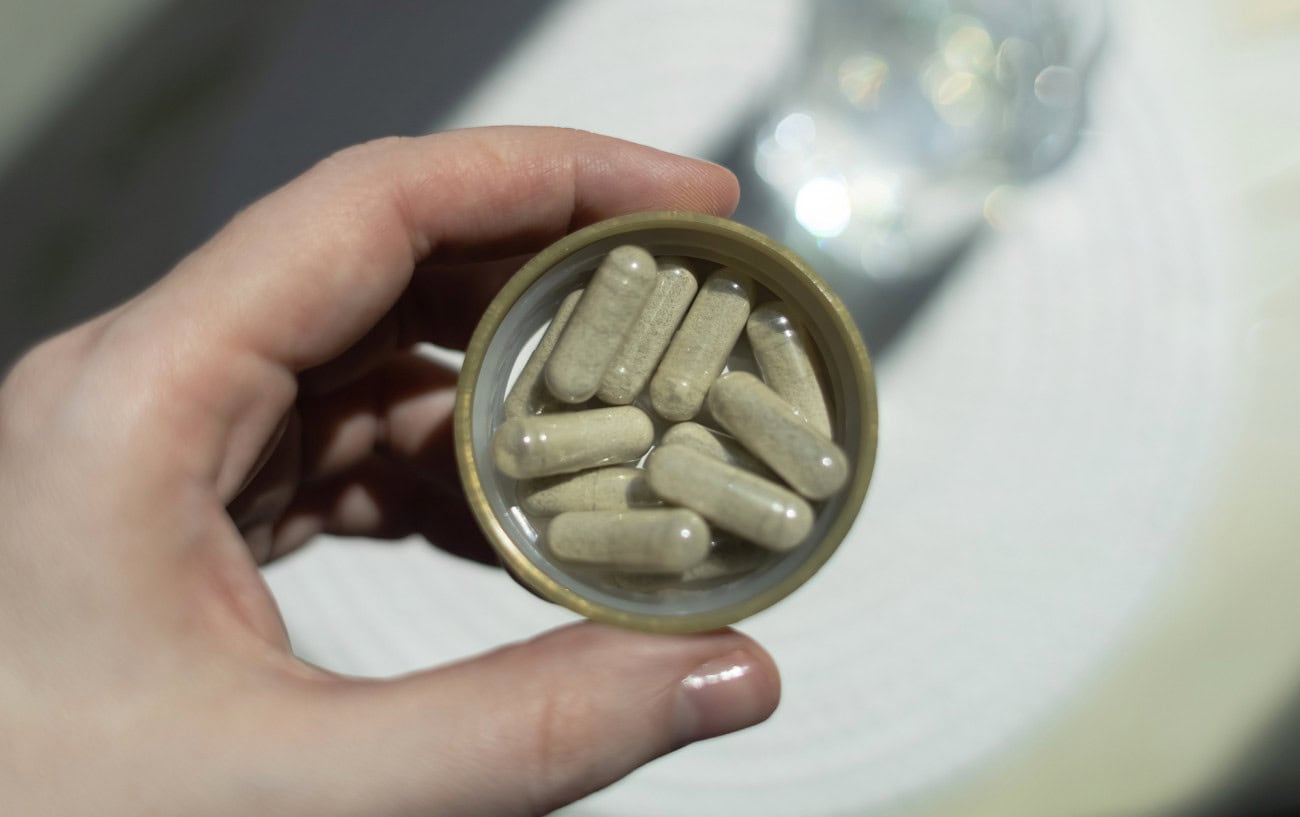 Iron Deficiency in Runners: Why It's Missed, How to Catch It, and What to Do About It 3 A capful of pills.