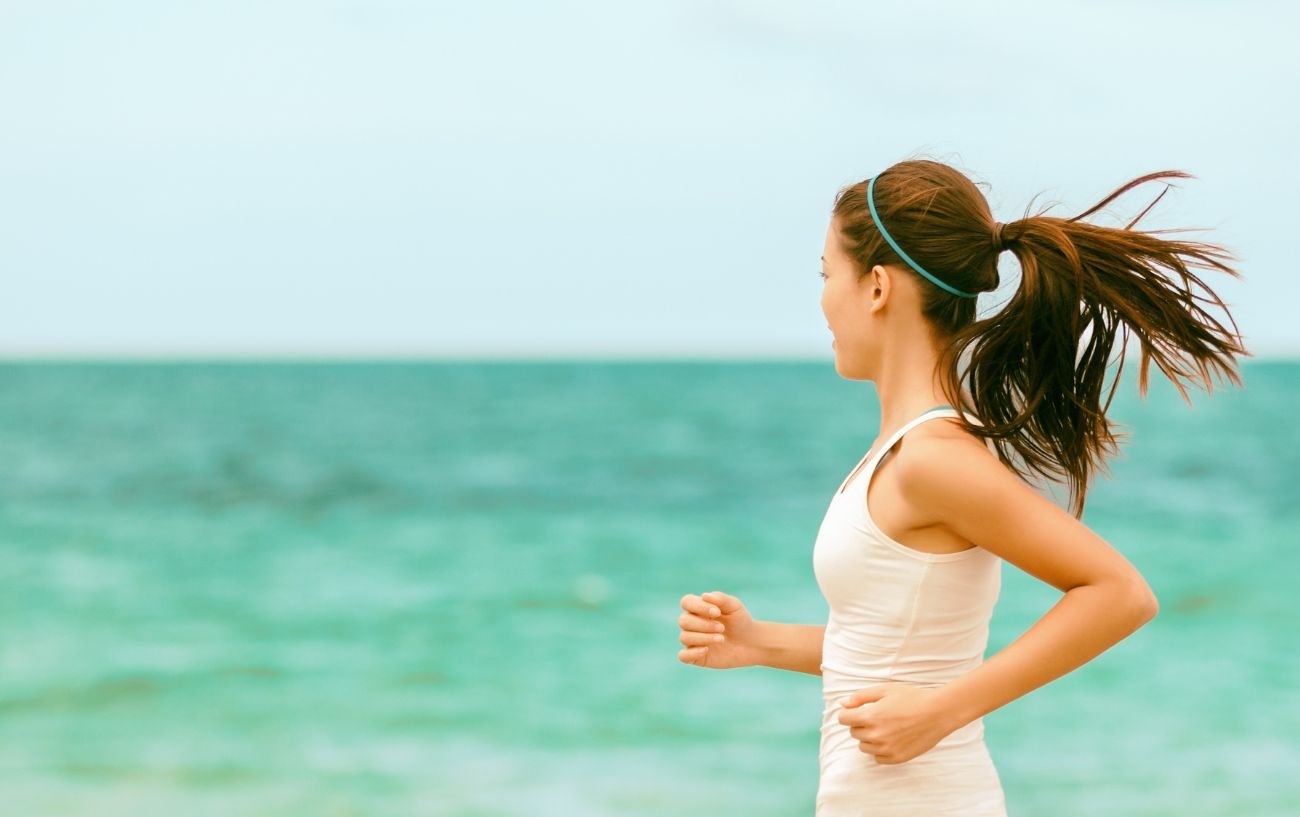 A person running on the beach.