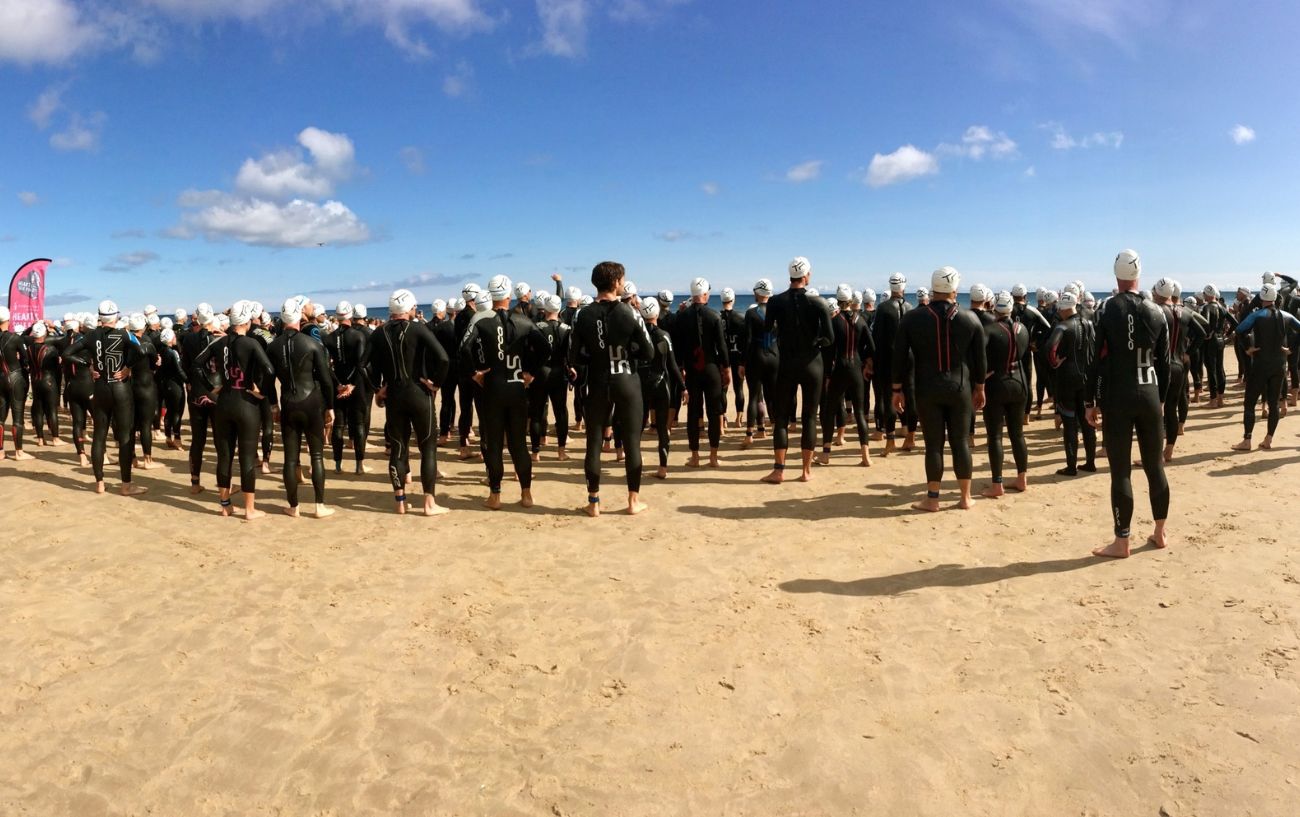 Swimmers waiting to begin their Ironman.