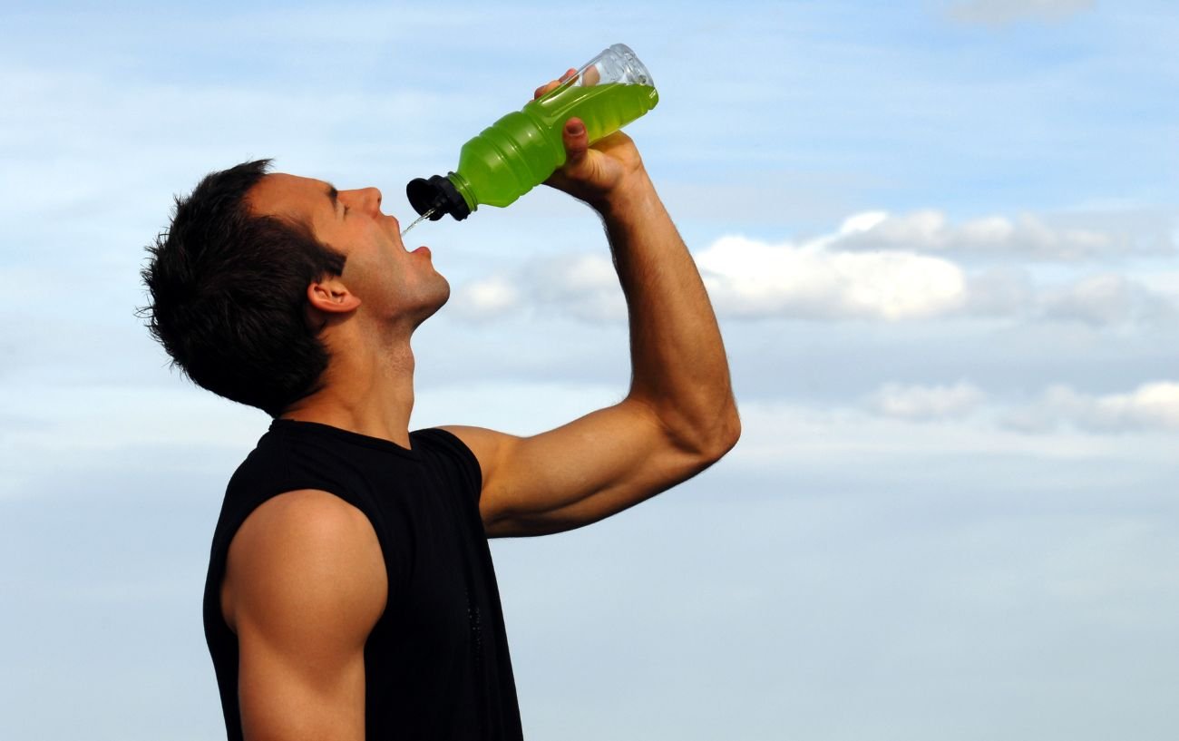 A person drinking Gatorade.