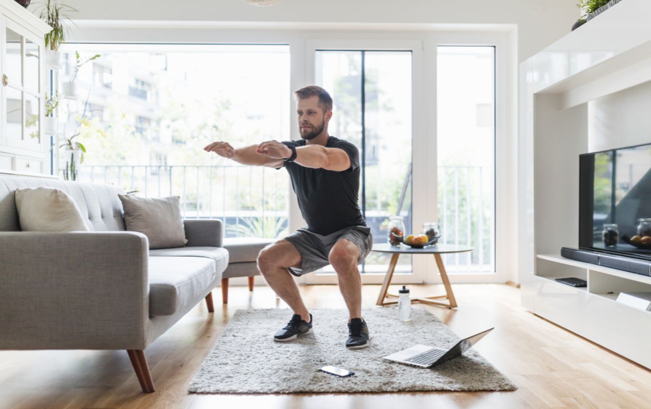 A person doing a bodyweight squat.