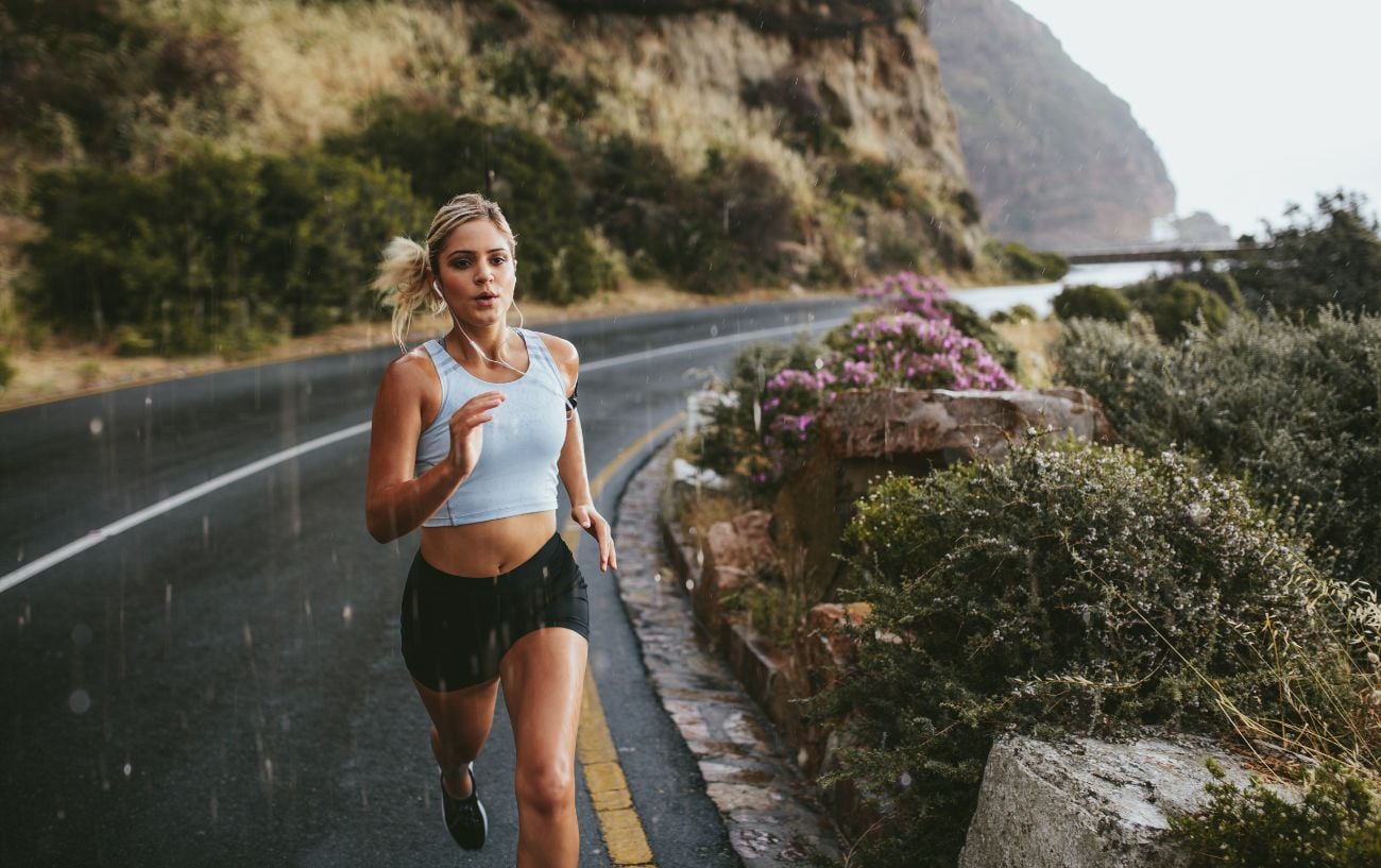 a woman running on a road