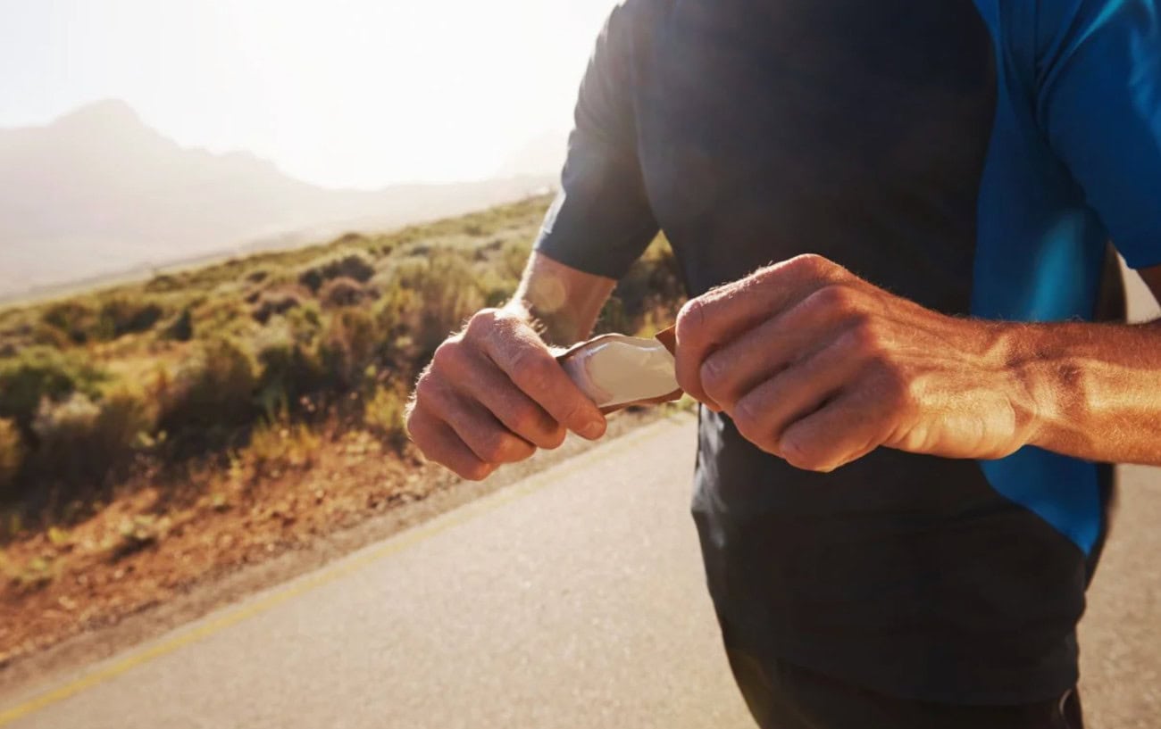 Runner adjusting a fitness tracker.
