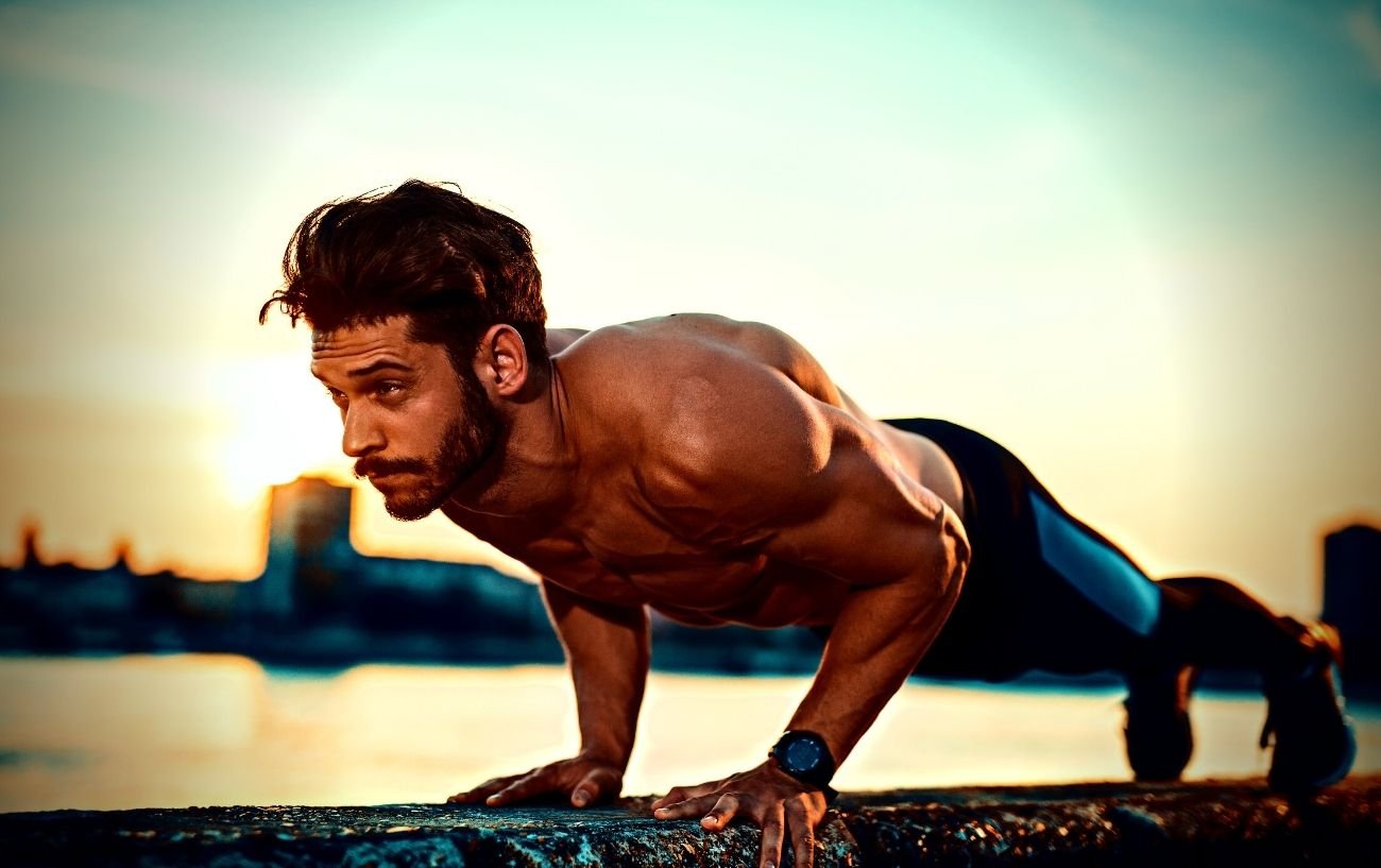 A person doing a pushup.