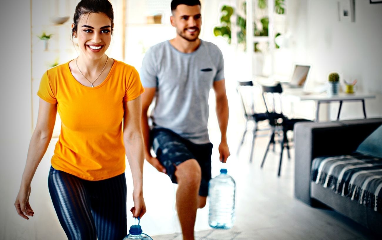 People working out with water jugs.