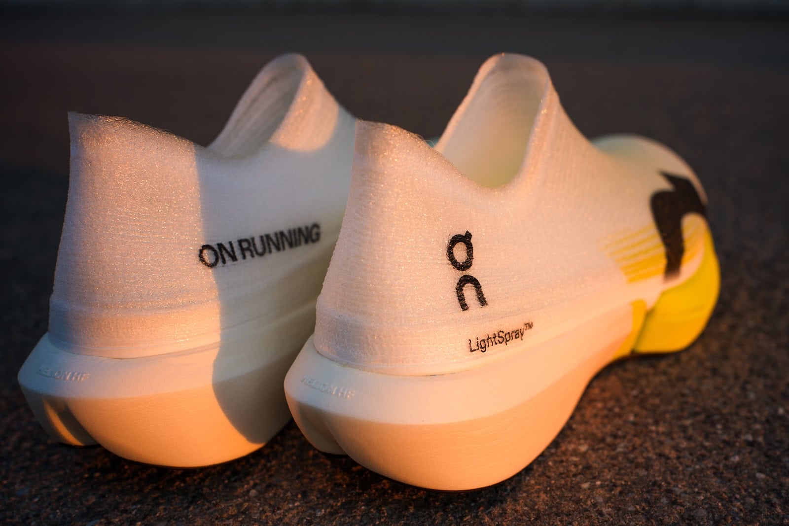 Heel view of the On LightSpray Cloudboom Strike 2 pair