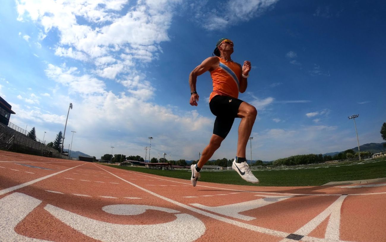 A person running on a track.