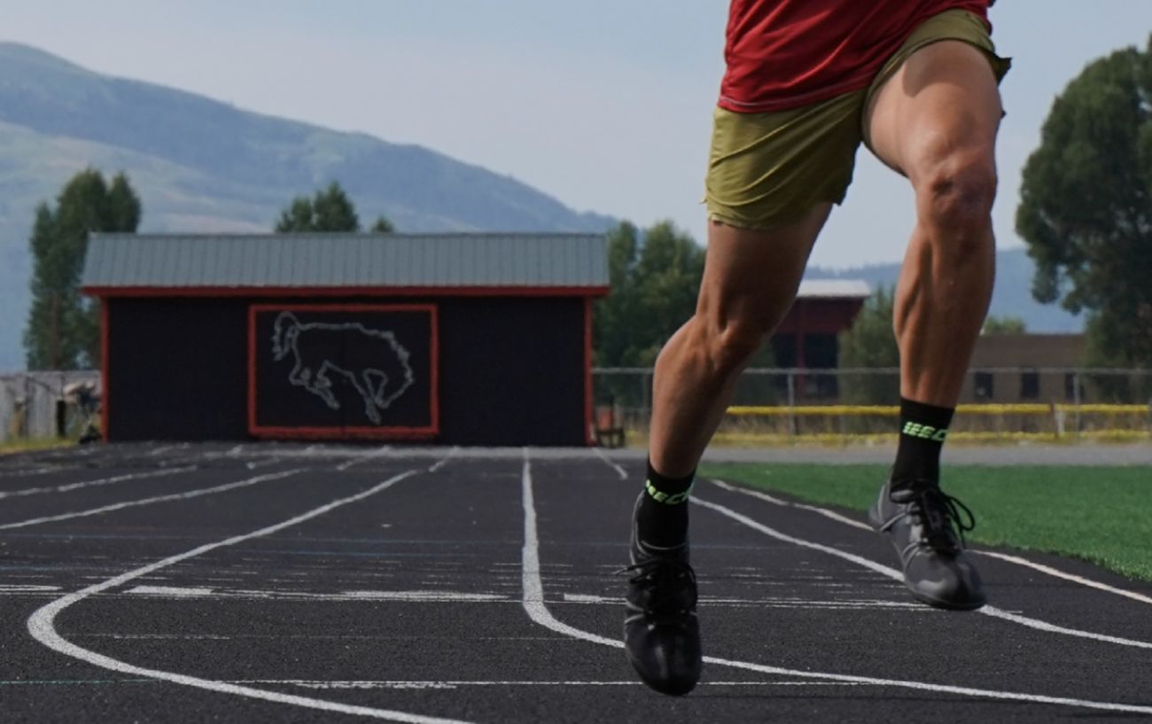 A person running on a track.