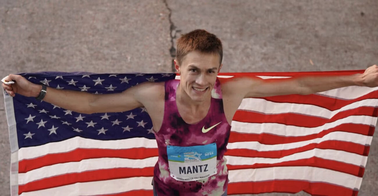 Athlete celebrating with American flag.