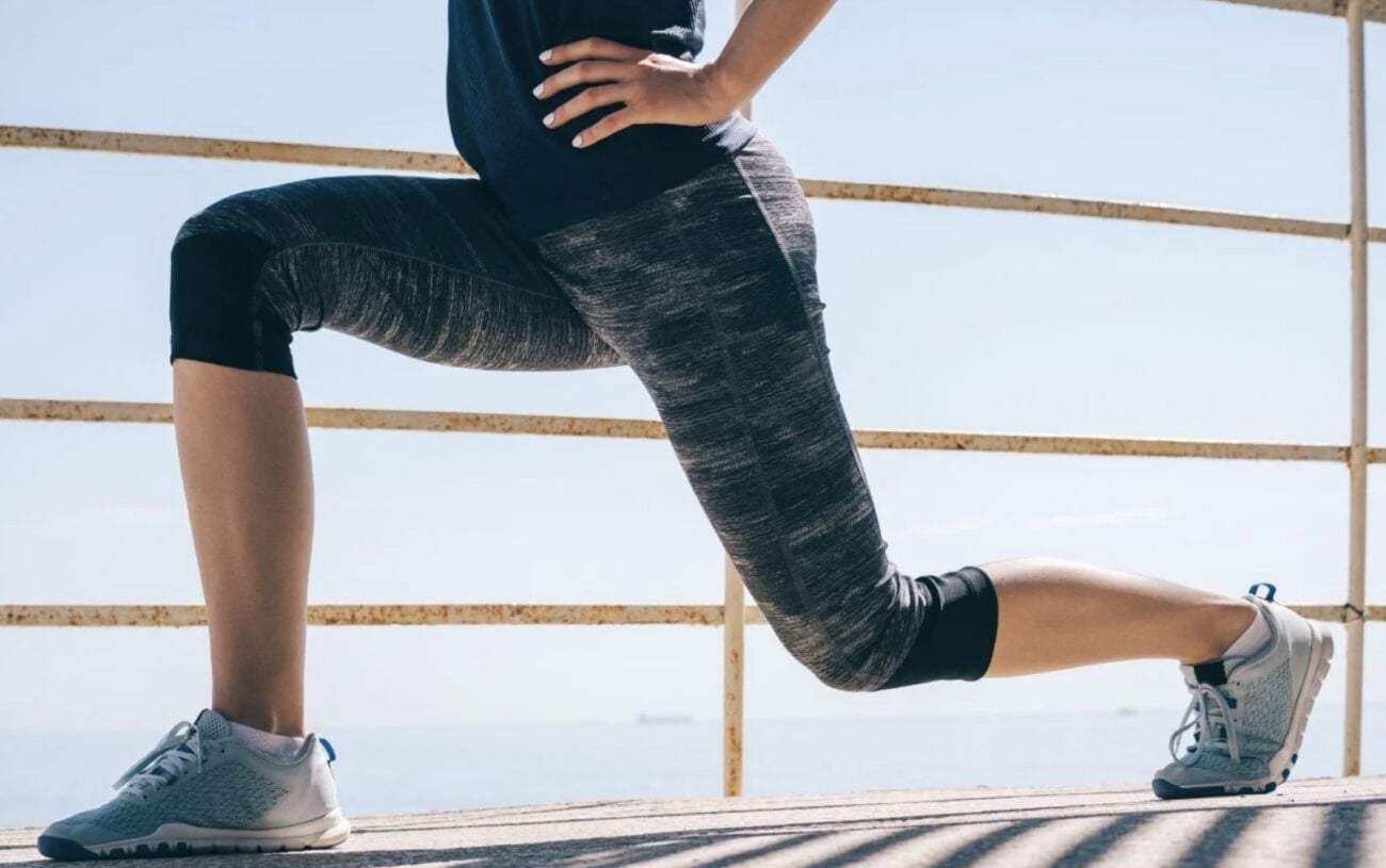 Person stretching in athletic wear.