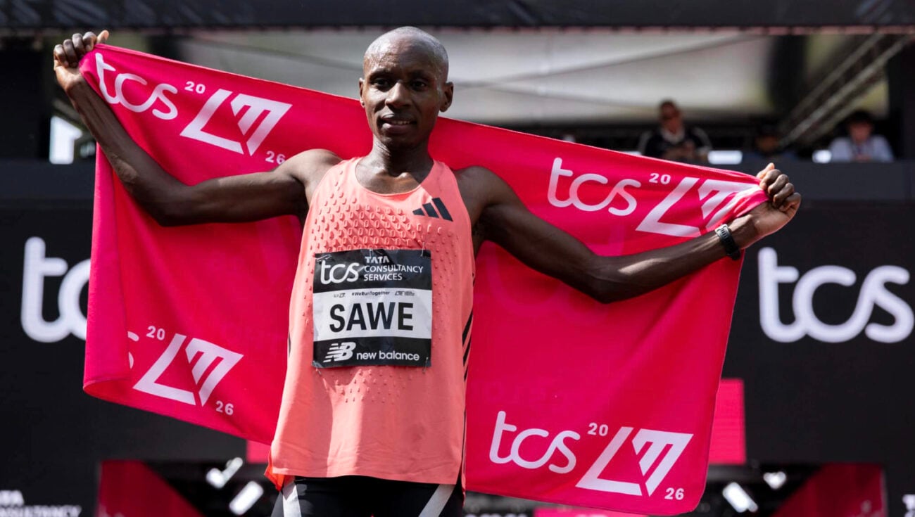 Sawe holding a TCS flag.