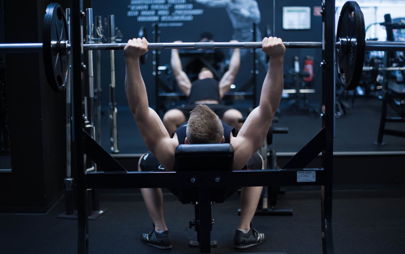 A person on a bench press.