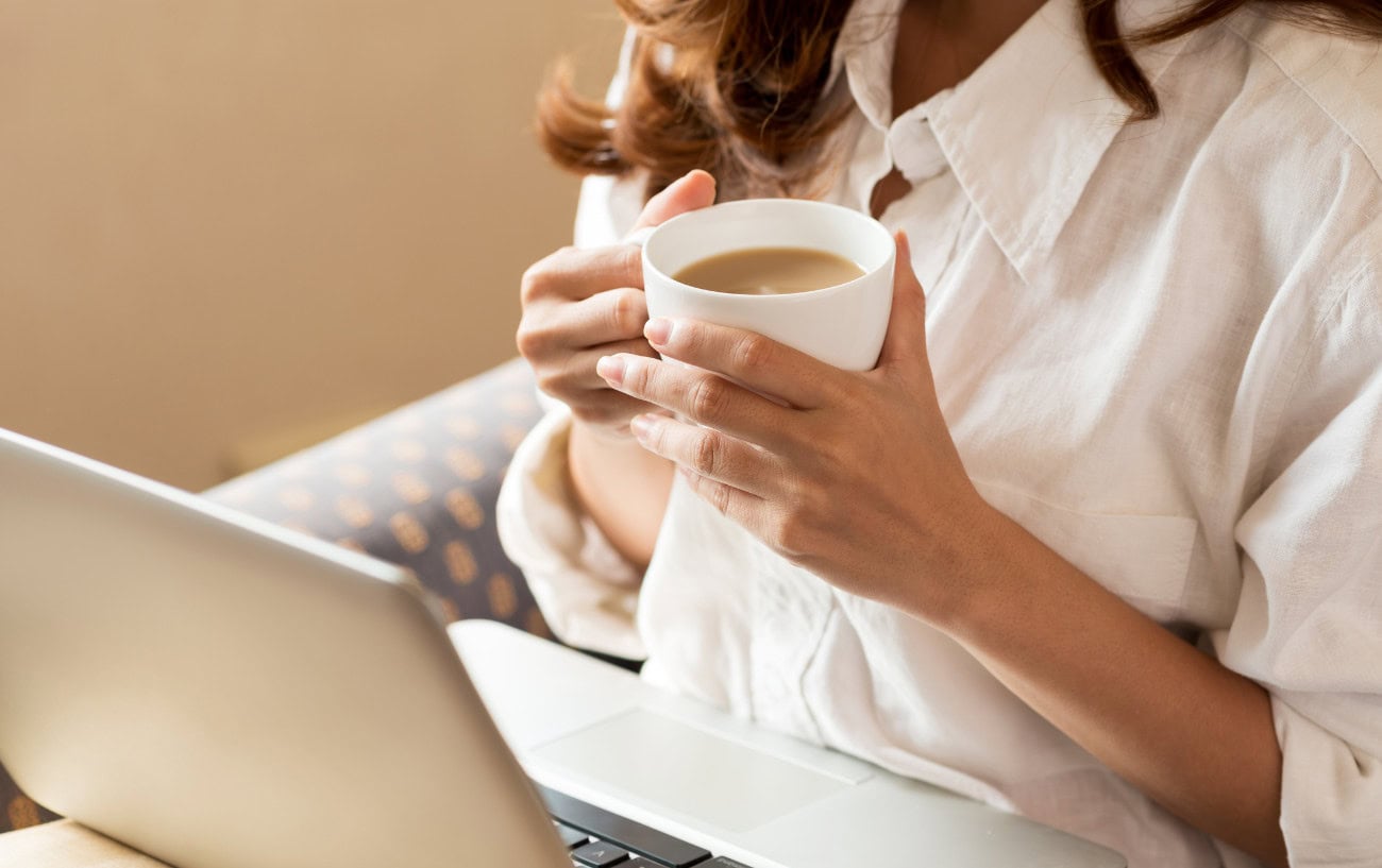 Sleep: The Essential Part of Training That Most Runners Overlook 6 a woman holding a cup of coffee