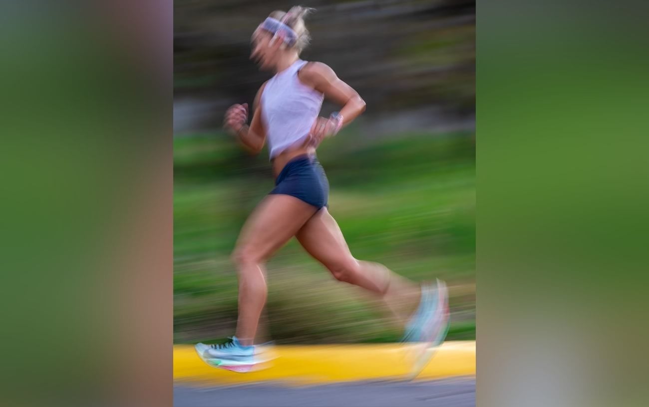 The Quiet Obsession Of The Sub Three-Hour Marathon 3 A blurred runner.