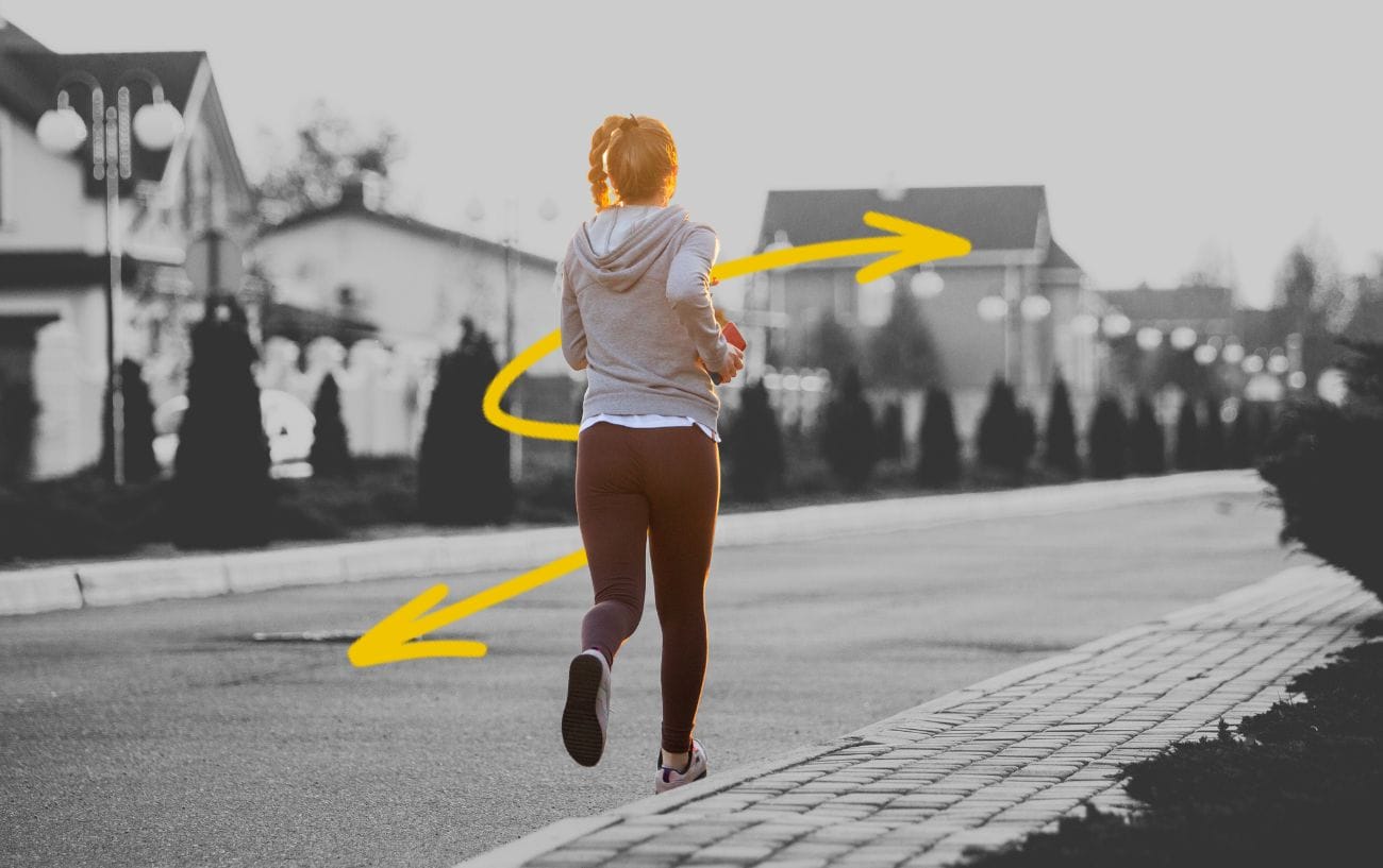 The 10% Rule: Is It a Valid Way to Increase Your Weekly Running Mileage? 1 a woman running on a street with yellow arrows