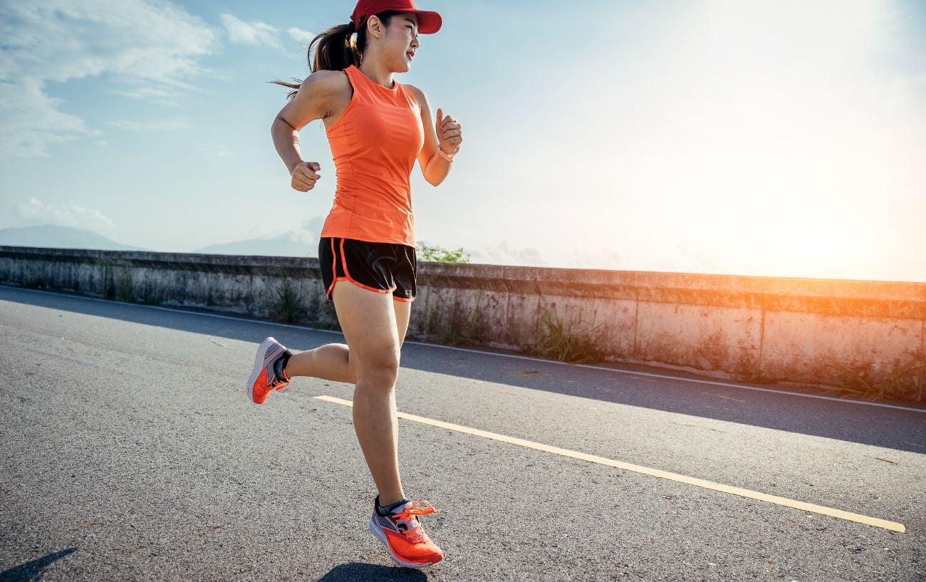 The 10% Rule: Is It a Valid Way to Increase Your Weekly Running Mileage? 2 a woman running on a road