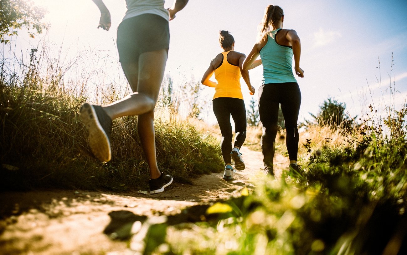 A Group Of Women Trail Running