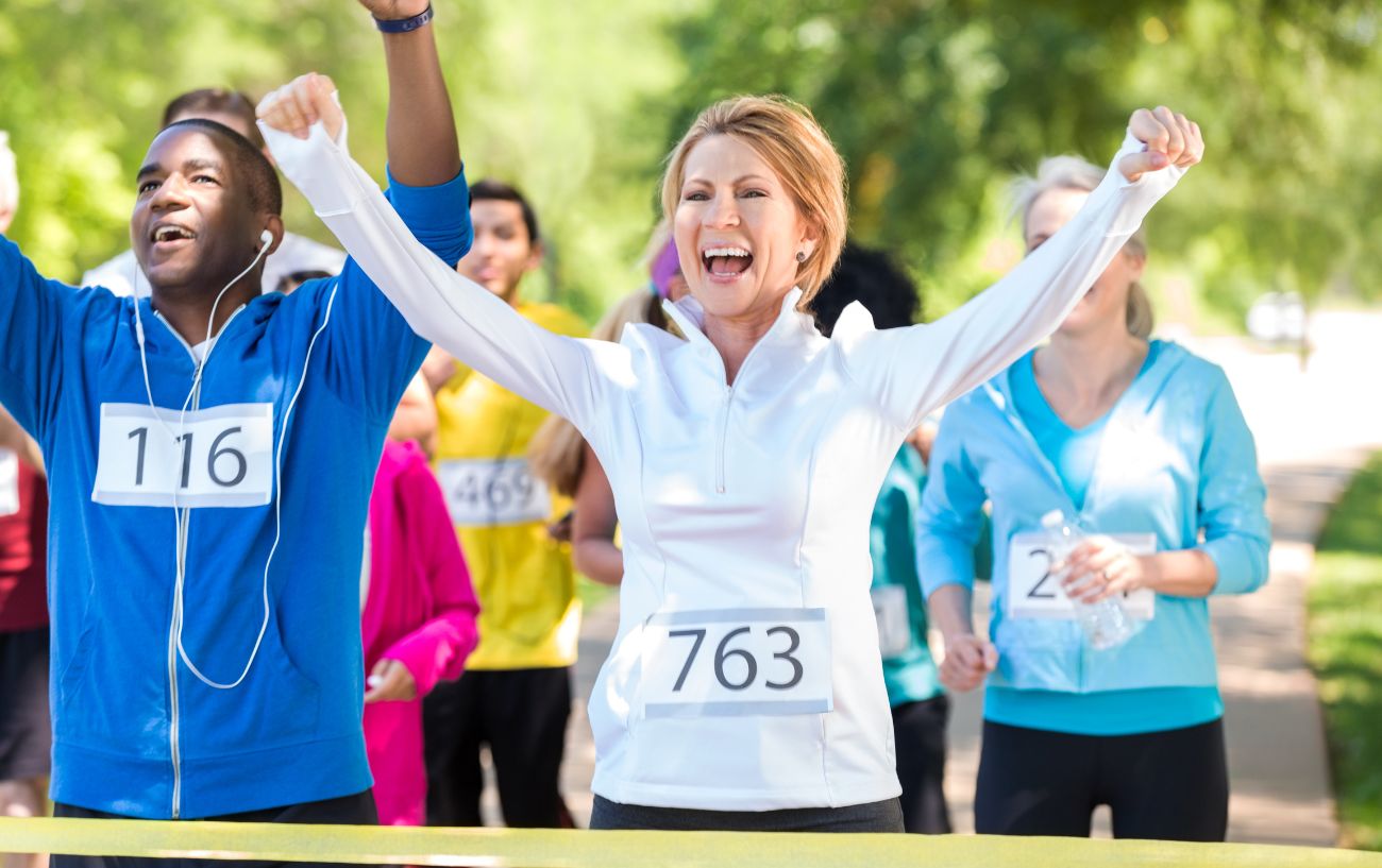 People smiling as they finish their 5k walk.