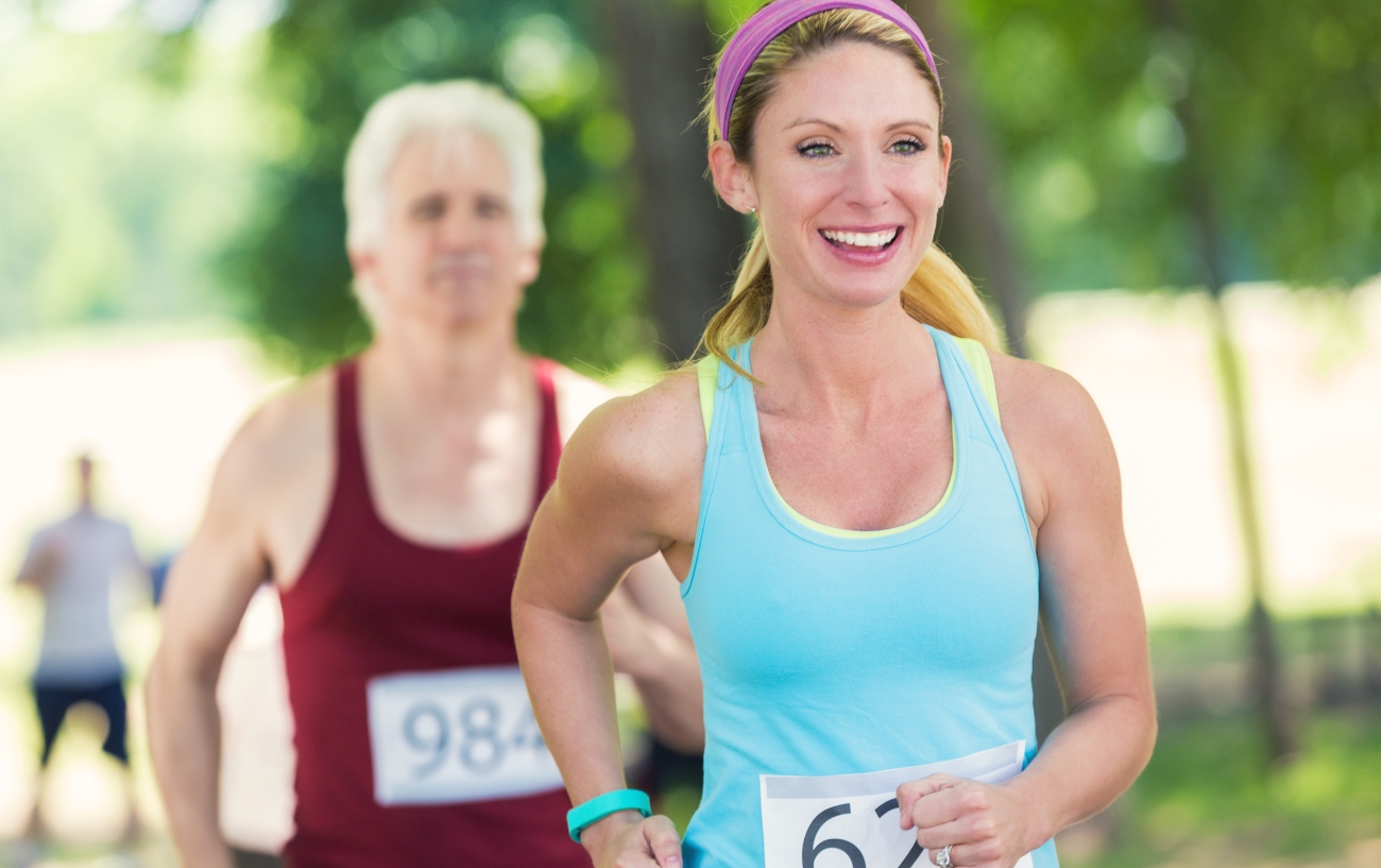 a woman running a 5k and smiling