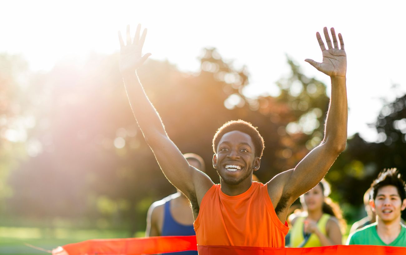 a runner crossing a race finish line