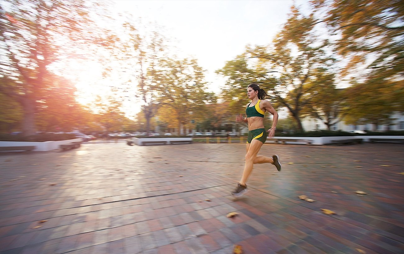 runner crossing a pedestrian area